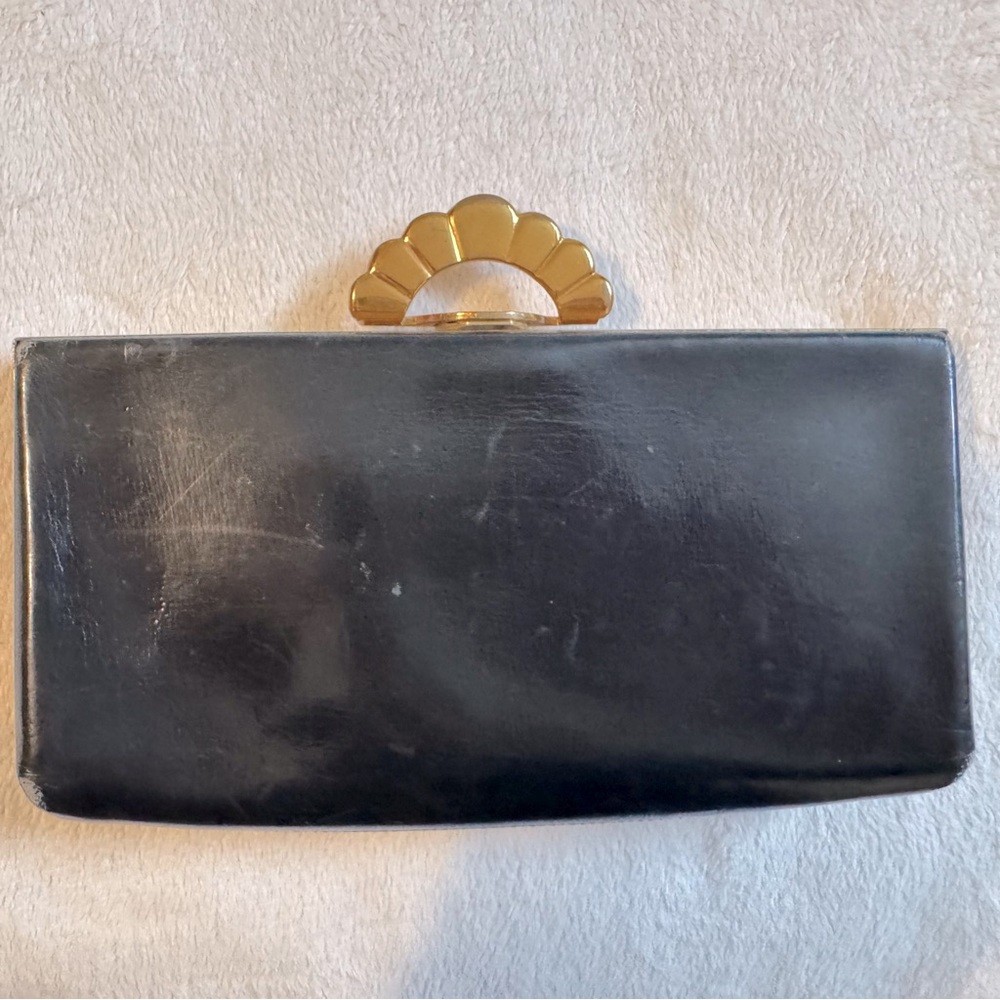 Evans. Vintage 1920-1940. Leather clutch/ purse with brass clasp and hardware.